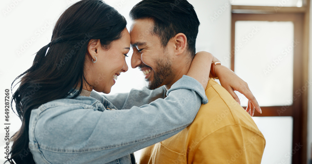 Couple, forehead touch and hug in living room with love, bonding and happy people together at home. Healthy relationship, trust and support in commitment, partner and dancing, romance and intimacy