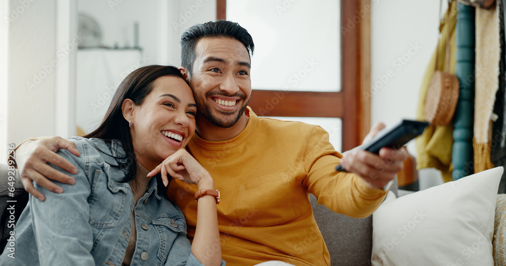 Happy couple, relax and watch movies on tv, news and cable show for media broadcast on sofa at home. Man, woman and people change television remote for streaming multimedia, subscription and choice