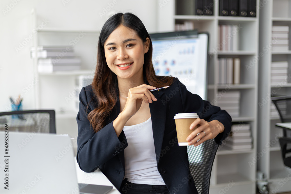 Portrait of a charming Asian businesswoman working in the office.