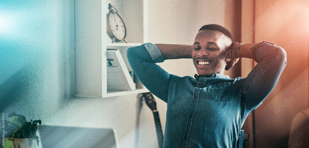 Relax, corporate and a black man with remote work and a laptop for good news or an email. Happy, success and a young entrepreneur or freelance employee enjoying a break from online career in a house