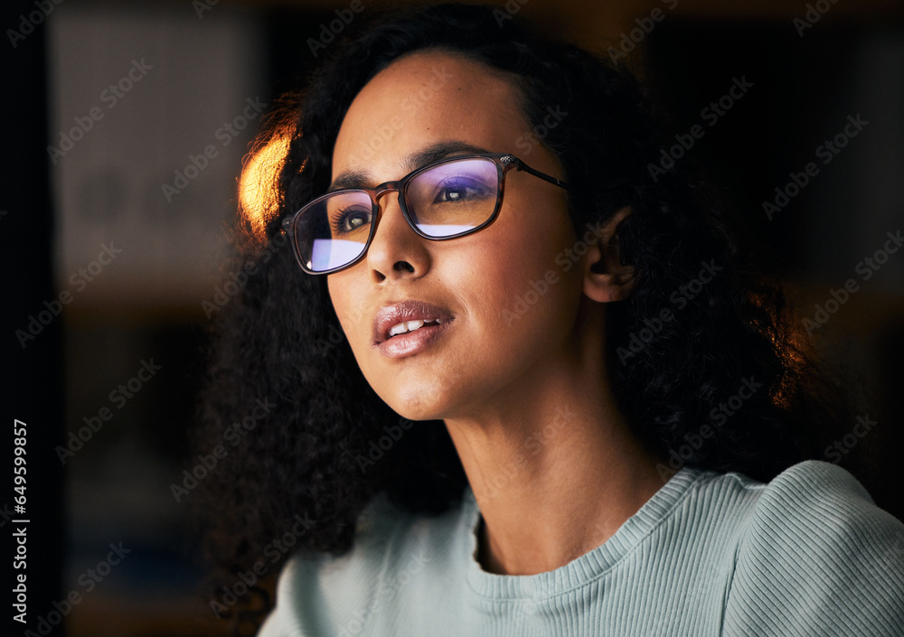 Business woman, glasses and reading on computer for programming, software or information technology solution. Young night programmer in screen reflection for IT problem solving, results or web coding