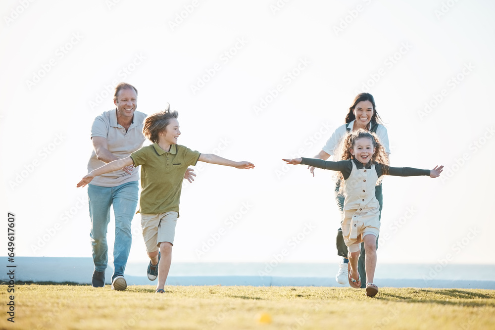 Running, parents and children in nature by ocean for bonding, relationship and relax together. Family, travel and happy mother, father and kids on holiday, summer vacation and playing for adventure