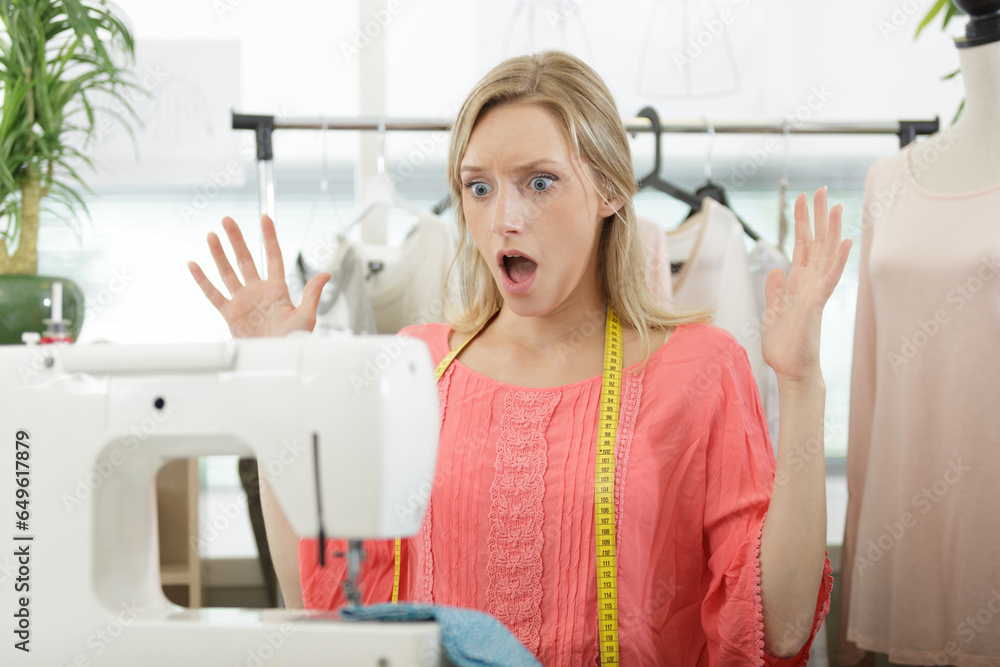 stressed young seamstress woman having difficulties