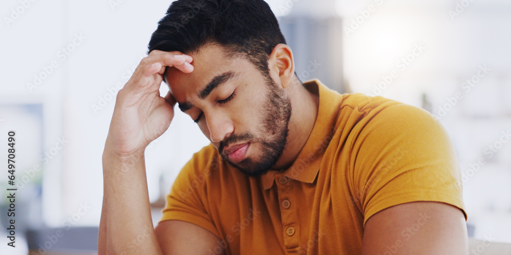 Laptop, typing and business man with headache, tired or exhausted with fatigue in workplace. Computer, migraine and depressed male professional with anxiety, burnout or sick, brain fog or stress.