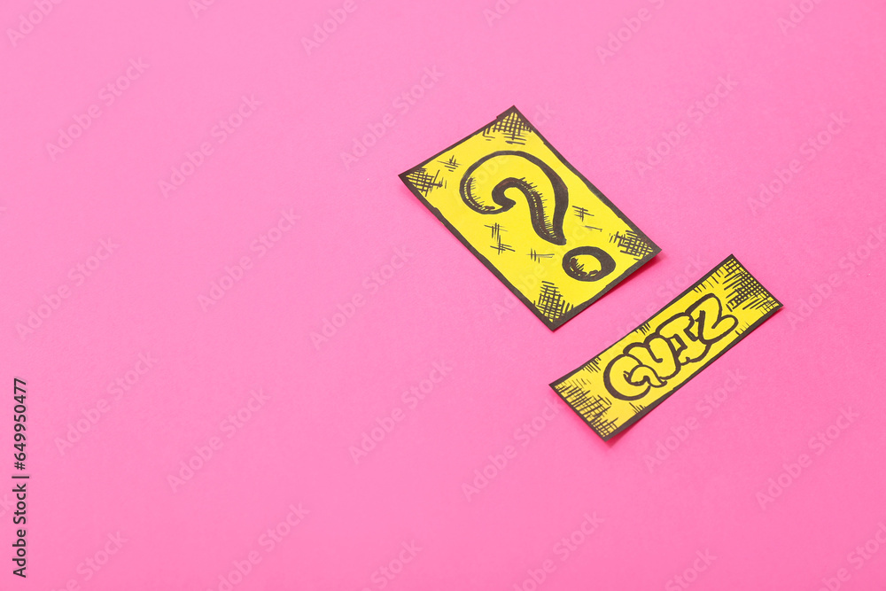 Paper quiz card with question mark on pink background