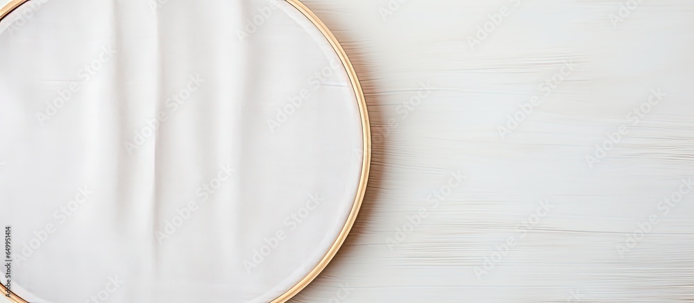 Empty space for hobby design with wooden embroidery hoop and white fabric template