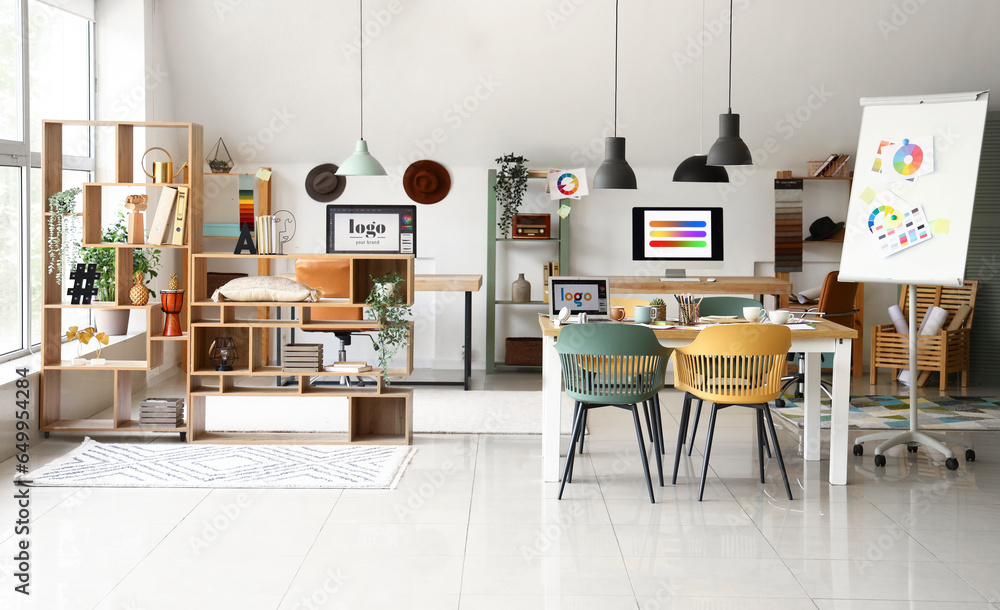 Interior of office with graphic designers workplaces