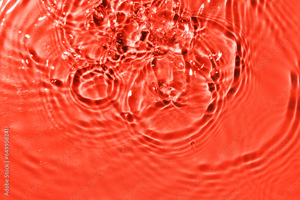 Macro view of rippled water on coral background