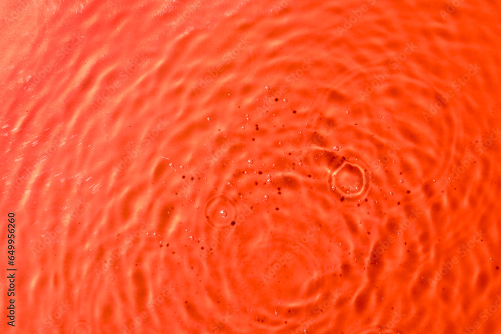 Macro view of rippled water on coral background