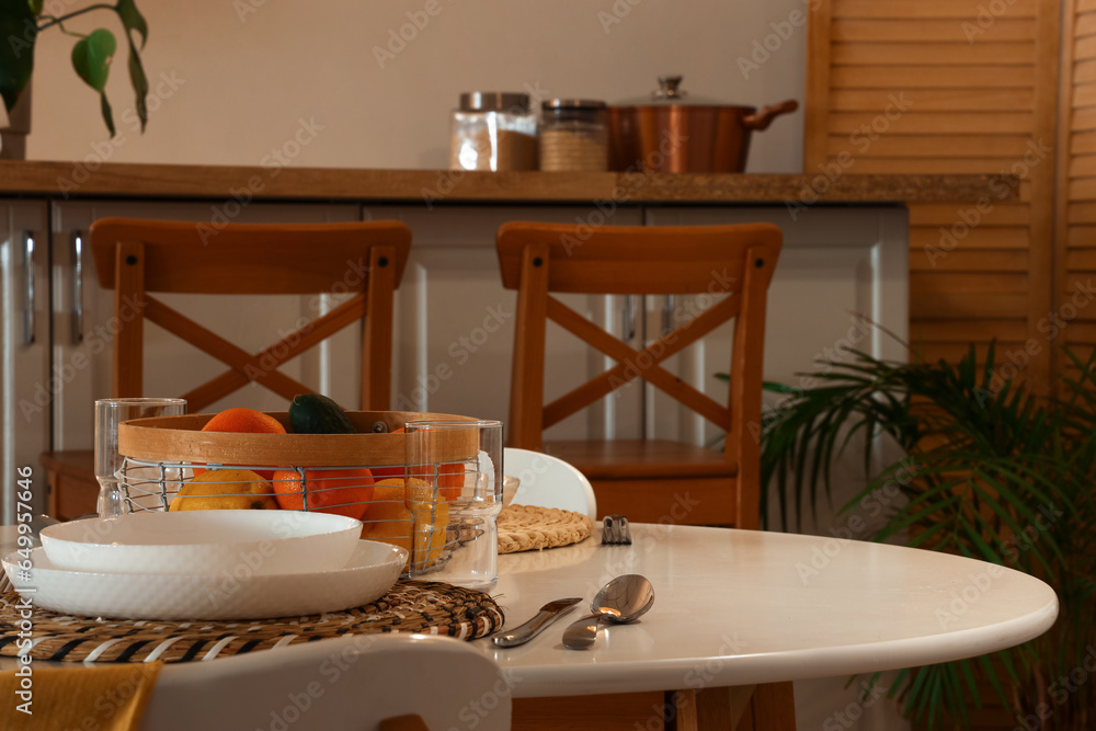 Healthy food on table in modern kitchen at evening, closeup