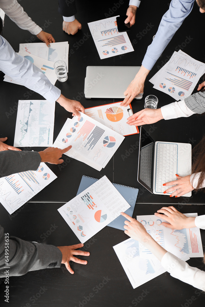 Group of business consultants working at table in office, top view