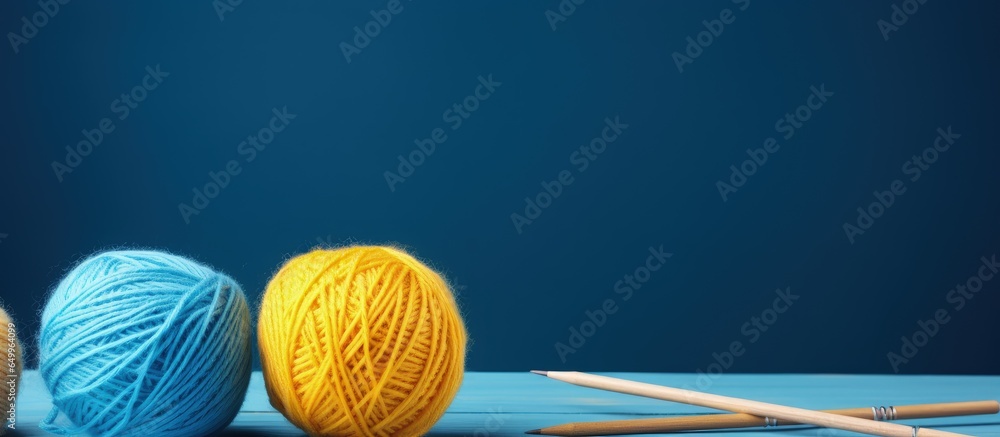 Knitting materials and workspace with blue and yellow elements