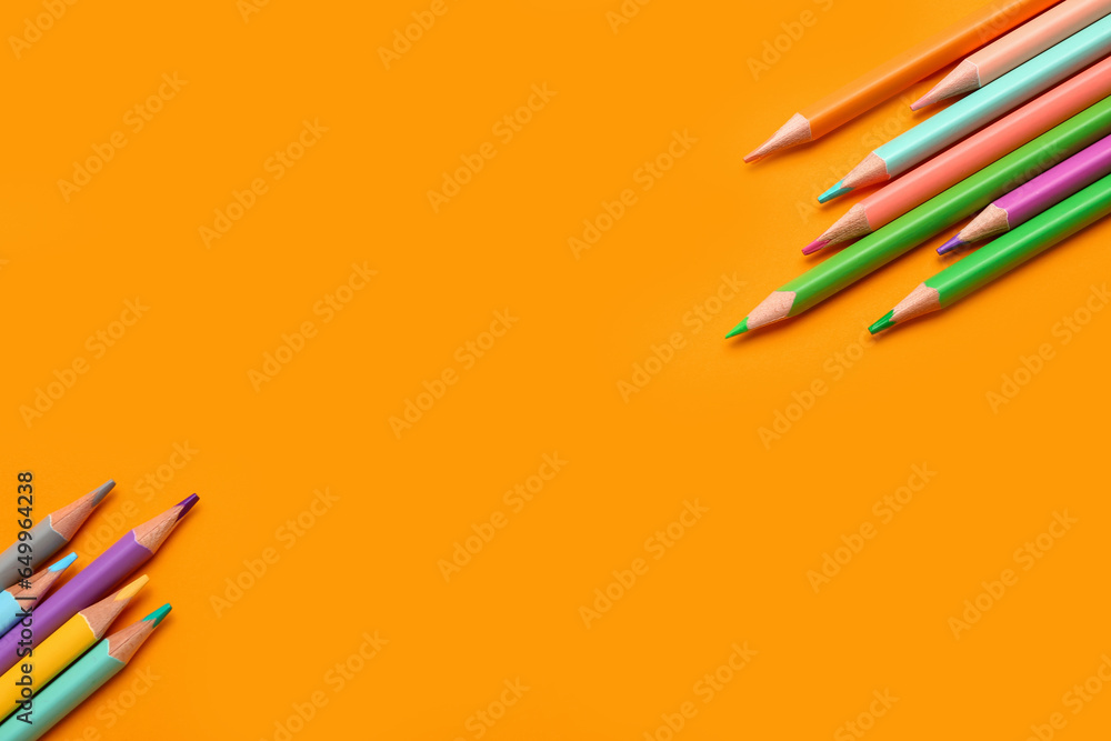 Group of colorful pencils on yellow background