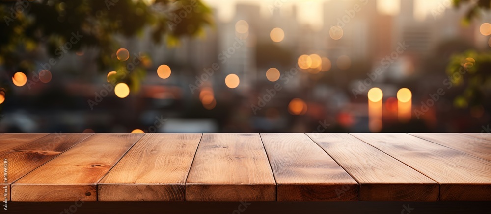 Wooden table top against blurred kitchen window background