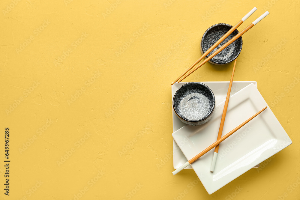 Chinese tableware on yellow background