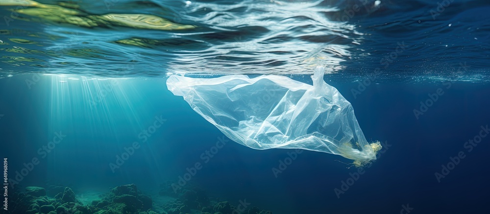 Melting plastic bag in ocean disperses waste symbolizes sea pollution and global warming