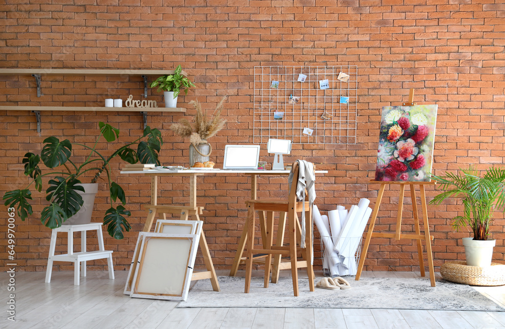 Interior of studio with artists workplace and drawing supplies