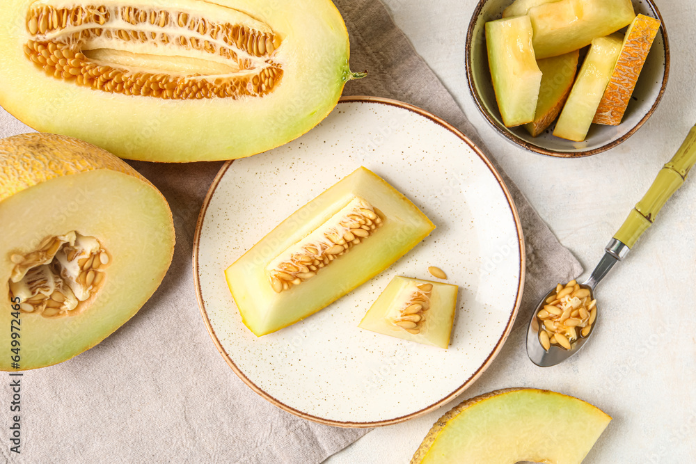 Plate and bowl with pieces of sweet melon on white background