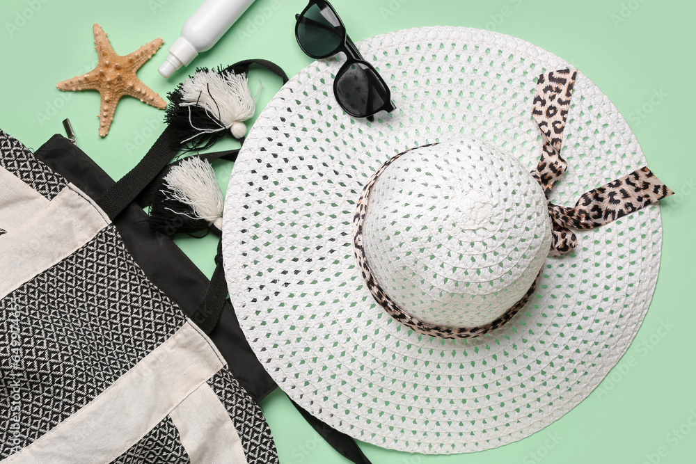 Composition with stylish beach accessories on color background