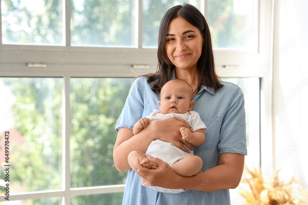 Young woman with her baby at home