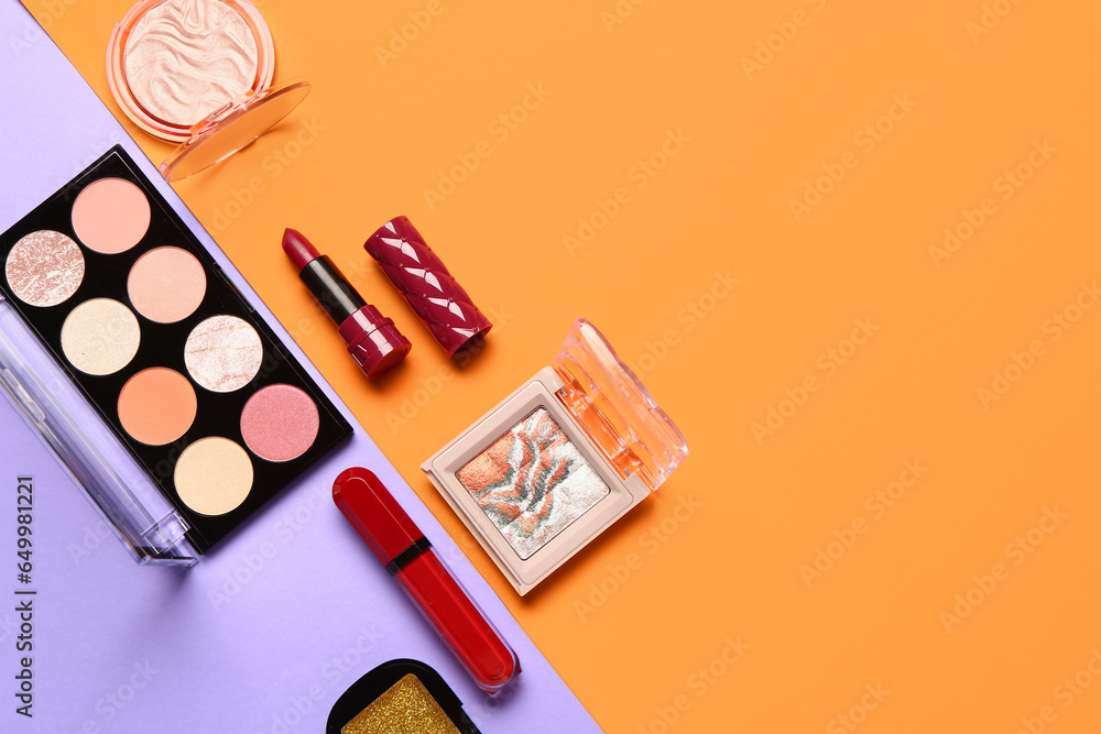 Beautiful palettes of eyeshadows and different decorative cosmetics on colorful background