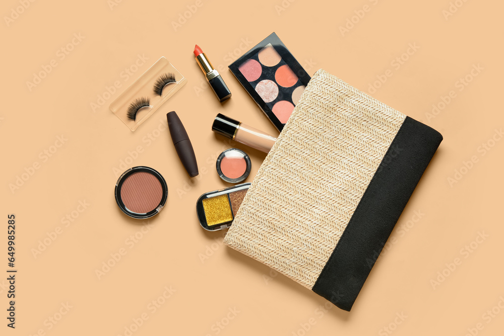 Wicker bag with different decorative cosmetics on orange background