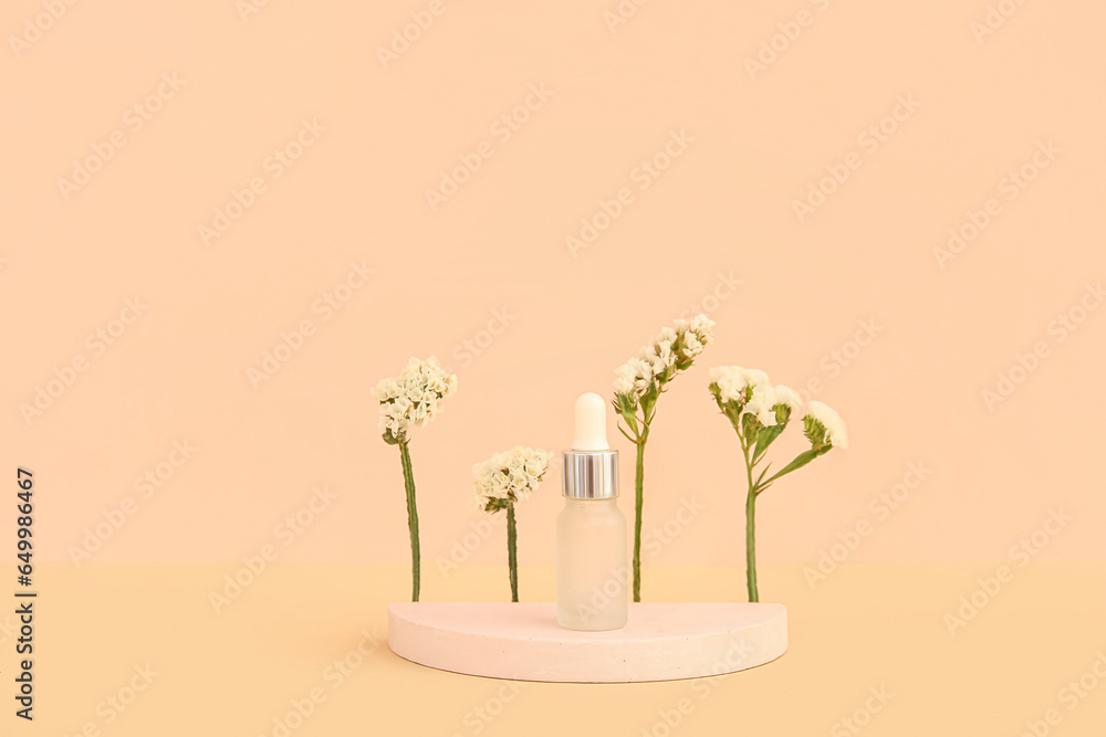 Composition with bottle of essential oil, plaster podium and beautiful flowers on beige background