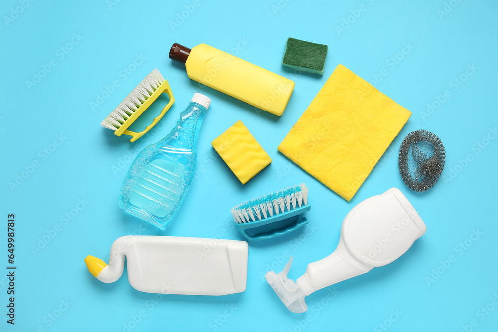 Set of cleaning products on blue background