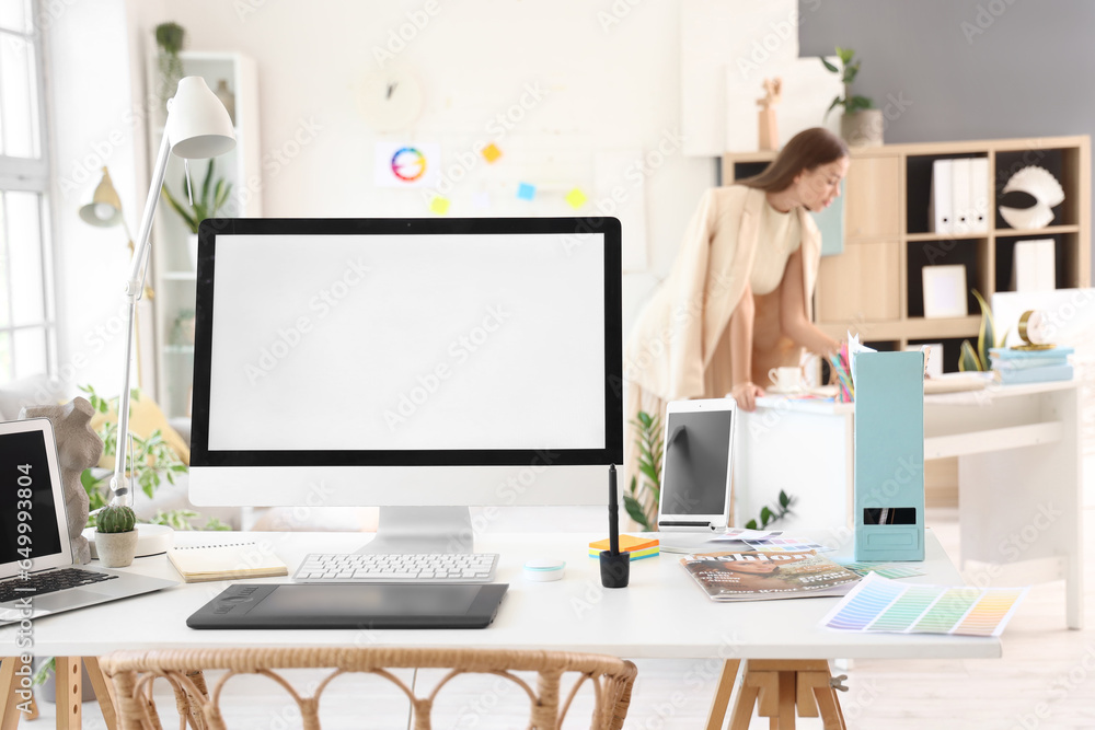 Interior designers workplace with computer in office