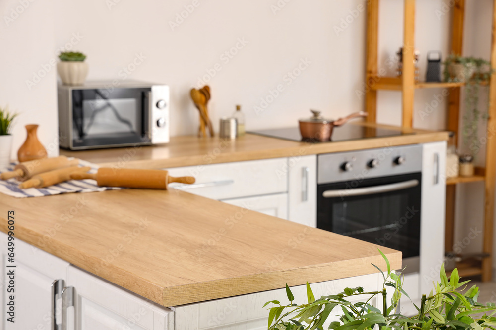 Wooden counter in light kitchen, closeup