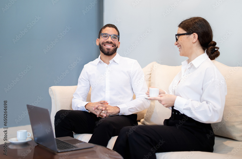 Smiling Businesswoman Conducting Job Interview with New Employee Man Indoor