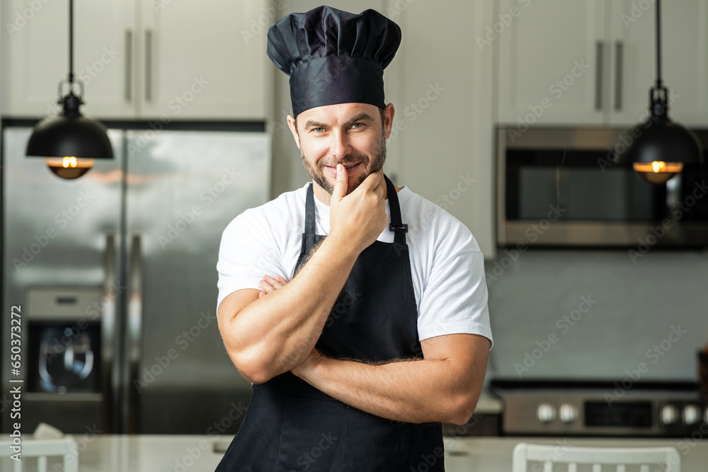 Cooking and culinary concept. Chef cook in uniform on kitchen. Male chef or cook baker man in apron cooking. Portrait of chef cook in beret. Cooking food concept.