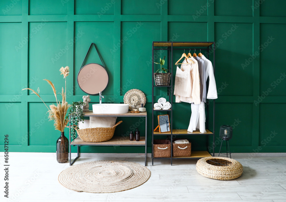 Interior of bathroom with sink and shelving unit