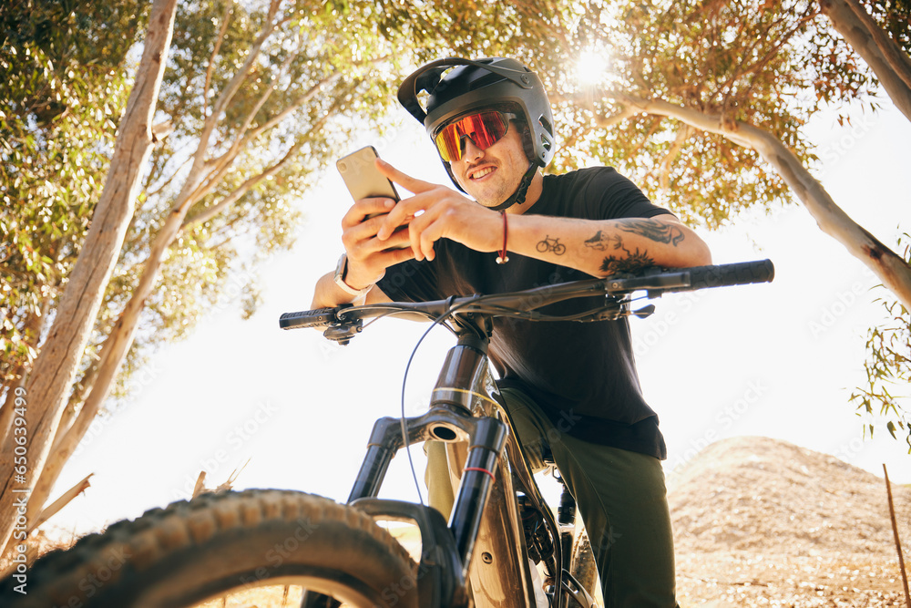 Bicycle, exercise and man with a cellphone, typing and connection with blog, influencer and social media. Person, biker or cyclist with a smartphone, digital app and internet with network and contact