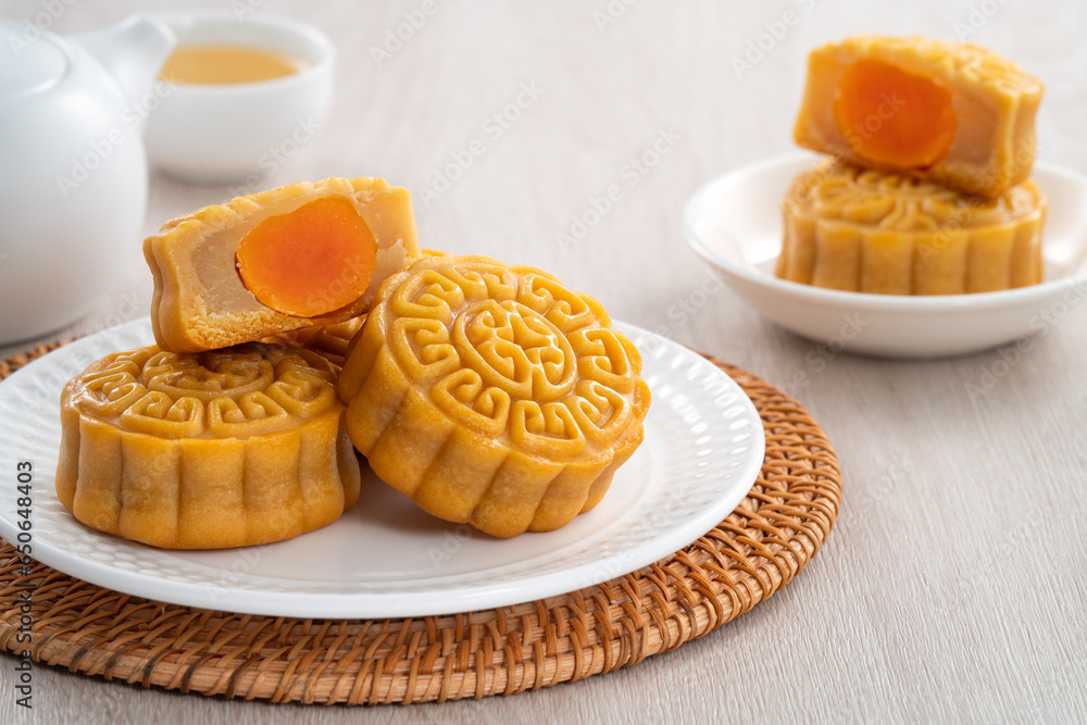 Delicious Cantonese moon cake for Mid-Autumn Festival food mooncake on wooden table background.