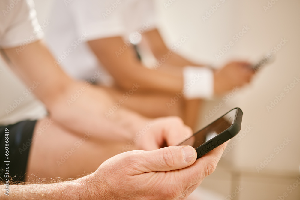 Person, hands and phone in social media, communication or networking after tennis or sports match. Closeup of athlete in online chatting, texting or browsing on mobile smartphone or fitness app