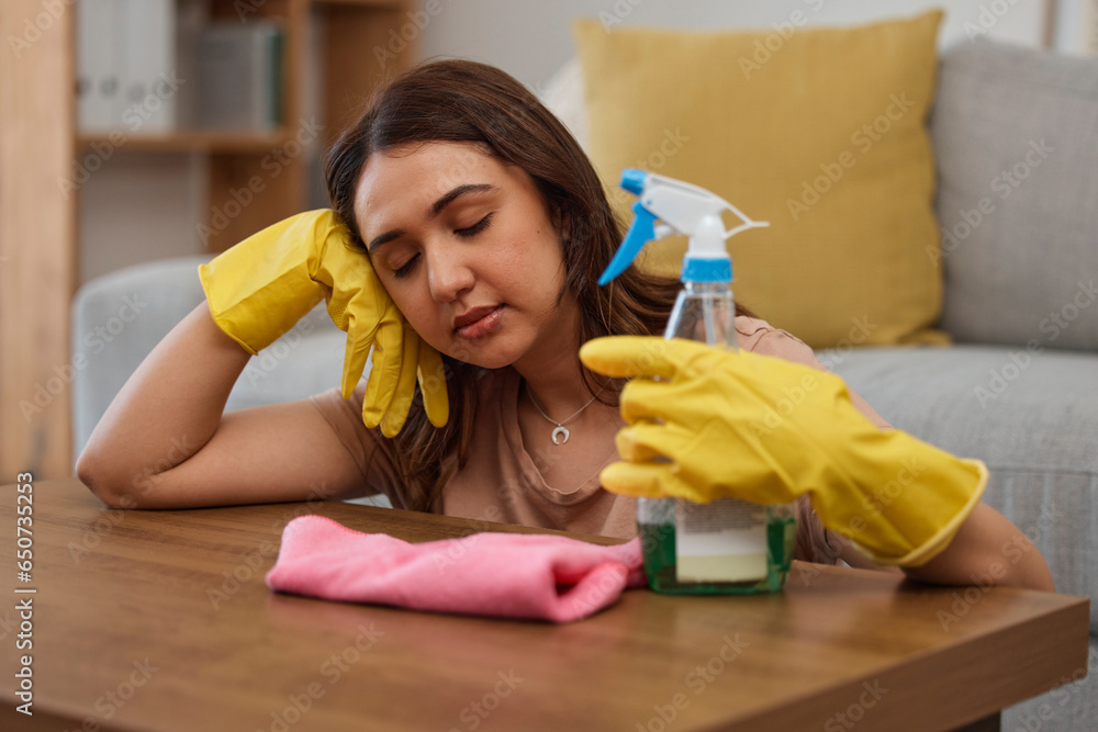 Tired maid woman, table and home on floor with cloth, gloves or bottle for detergent spray for spring cleaning. Burnout, fatigue and cleaner with soap in house for sleeping, rest or exhausted at desk