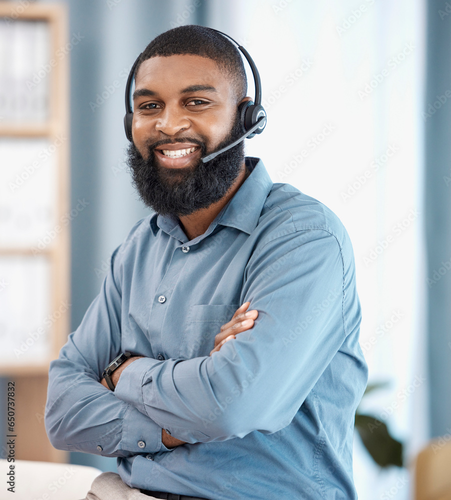 Man, call center and arms crossed in office, portrait or confident, pride or telemarketing job with smile. African CRM, consultant or customer support agent with microphone, headphones or networking