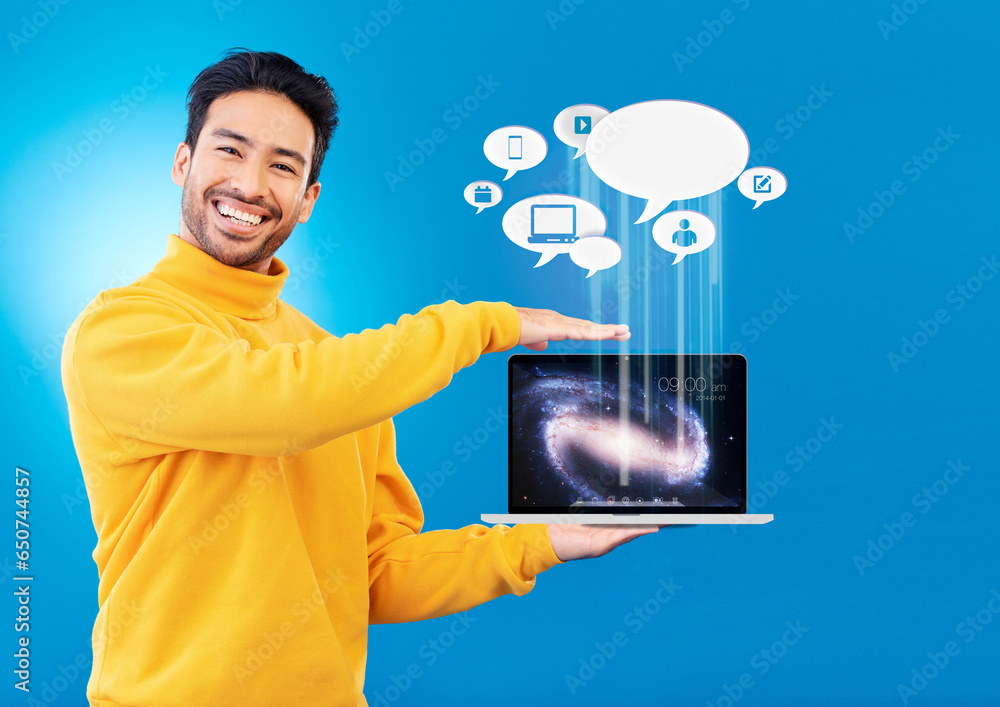 Laptop, social media icon and portrait of Asian man in studio for internet chat, website or networking. Overlay, computer mockup and person for online communication or connection on blue background