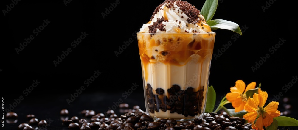 Asian cold coffee drink with tapioca balls coconut cream and caramel sauce