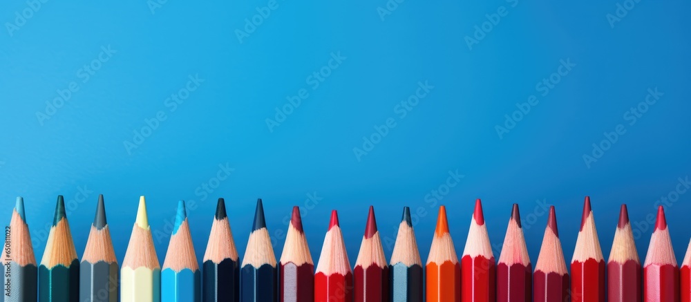 A single red pencil on a blue background symbolizing leadership and standing out from the crowd