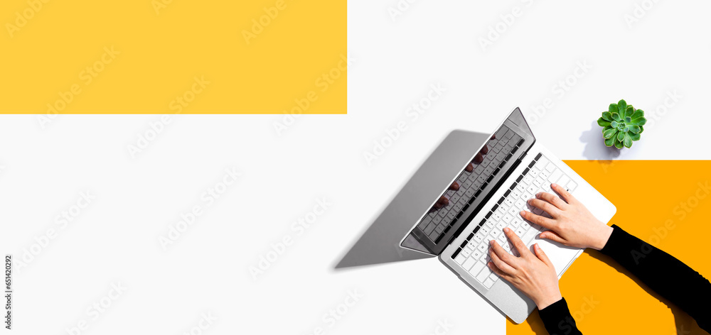 Person using a laptop computer from above