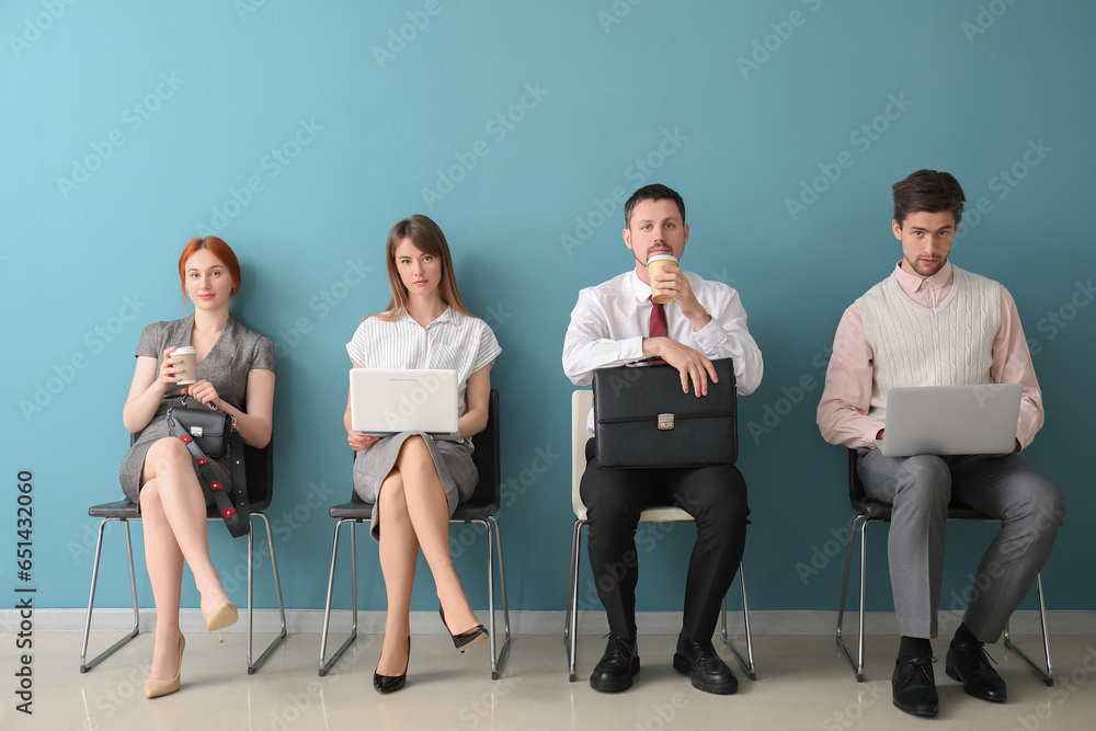 Young applicants waiting for job interview in room