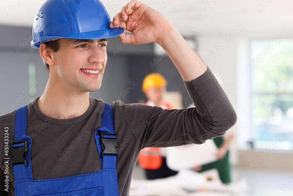 Male builder working in room, closeup