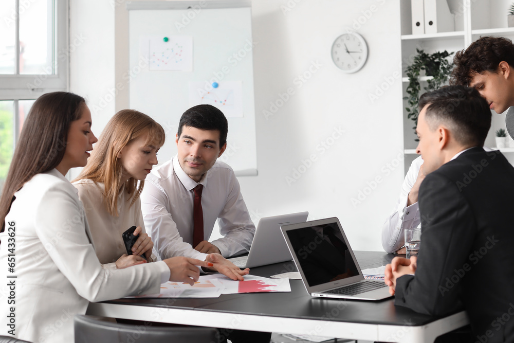 Group of business consultants working in office