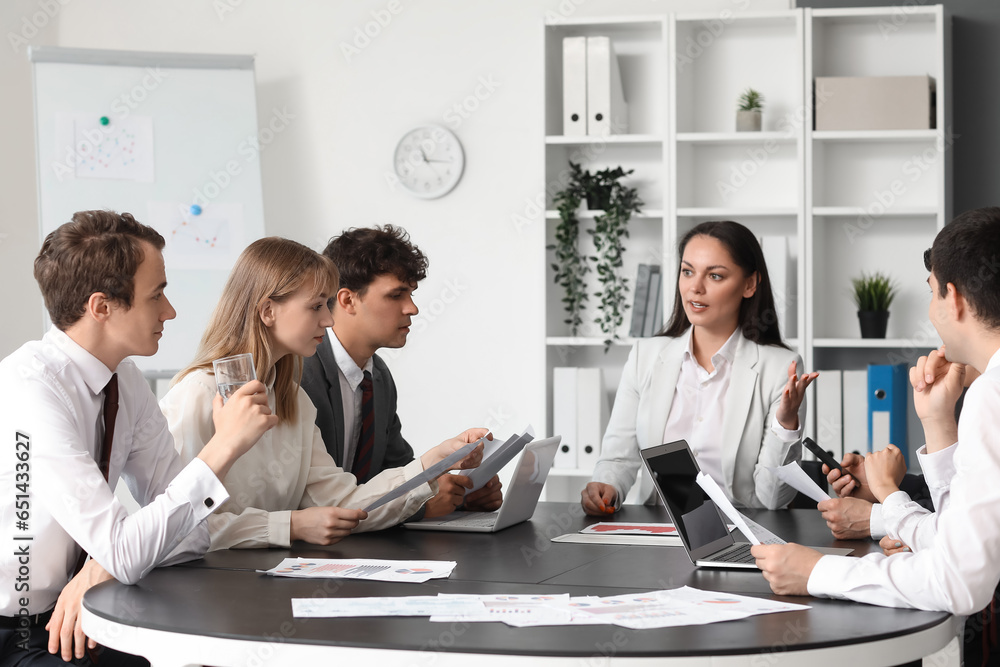 Group of business consultants working in office