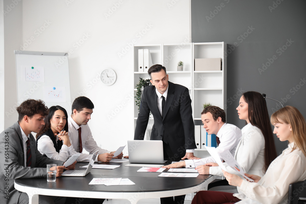 Group of business consultants working in office