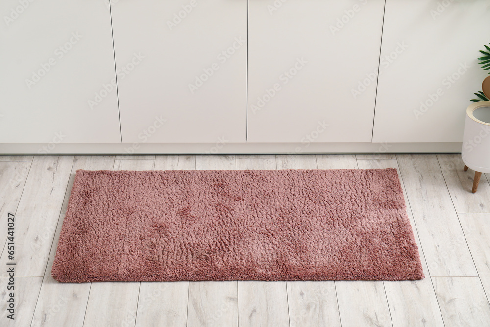 Soft rug on floor in kitchen