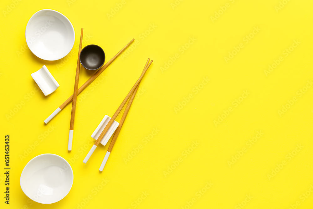 Chinese tableware on yellow background