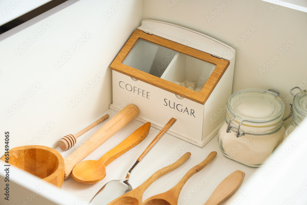 Set of utensils for bakery in drawer at kitchen